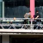 Window washer falls 11 stories, hits car and survives